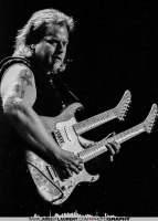 Smokin' Joe Kubek playing a double-neck guitar